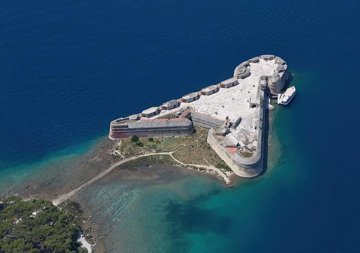 Aerial view of St. Nicholas Fortress on its islet at the entrance to St. Anthony Channel
